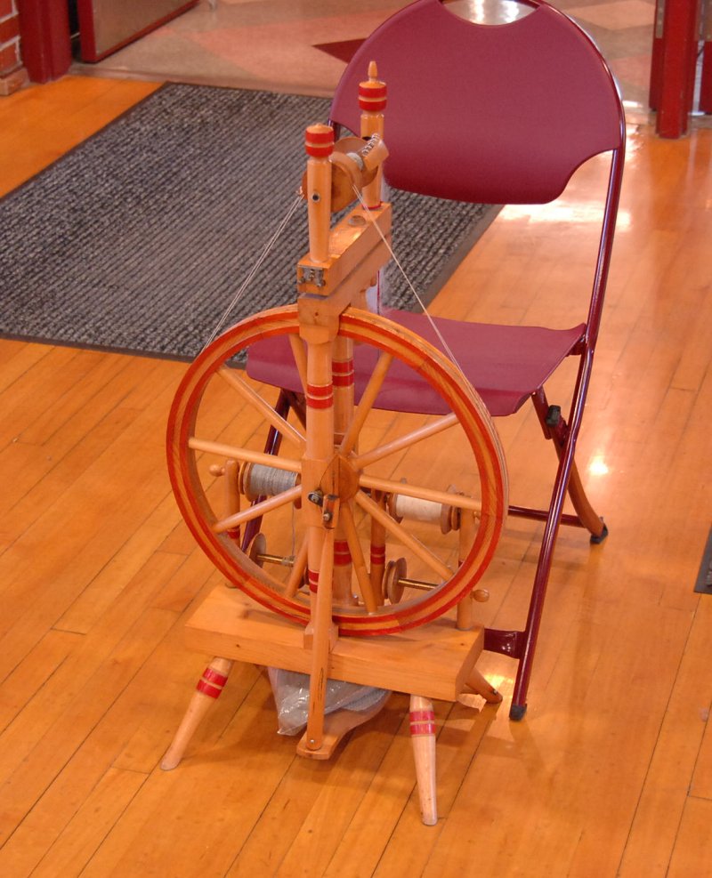 Castle spinning wheel with red rings