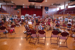 Gymnasium covered with chairs and spinning wheels