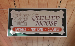 Sign hanging from ceiling
