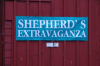 Sign on red barn, Shepherd's Extravaganza.