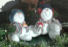 Snow people with hats and scarves