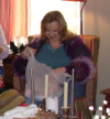 Woman getting present out of bag.